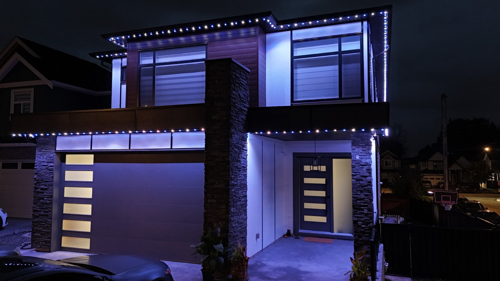 Modern home with blue and white permanent lighting