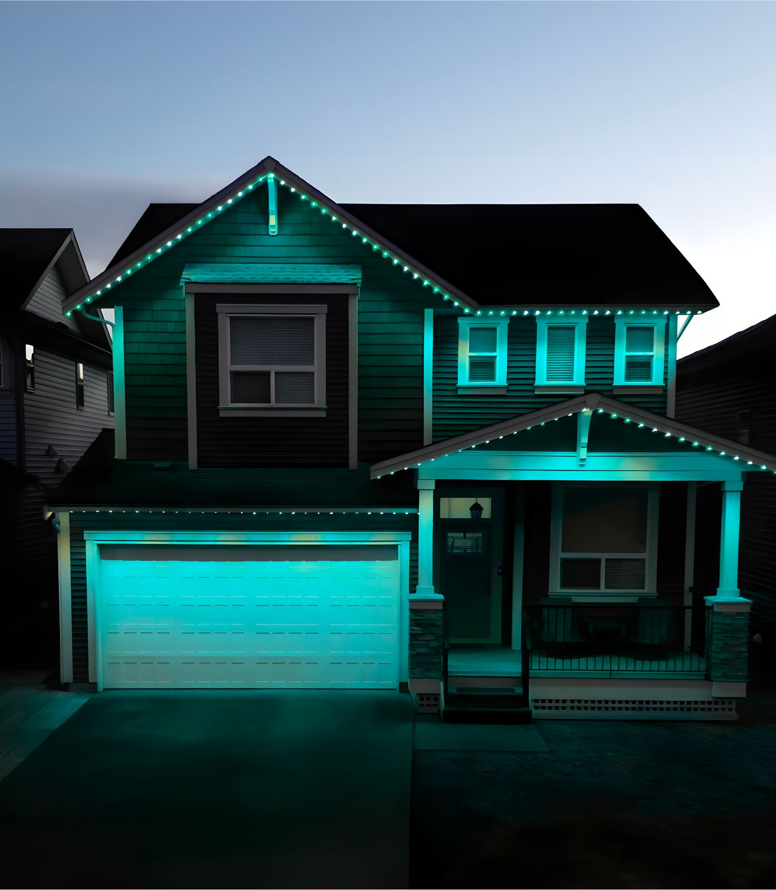 Edmonton home illuminated with teal permanent lighting