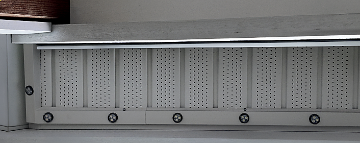 Low-profile permanent exterior lighting track installed neatly along a finished roofline